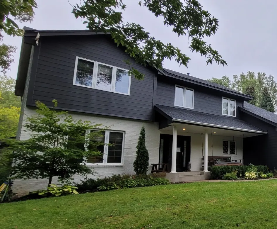 After: navy siding with white trim