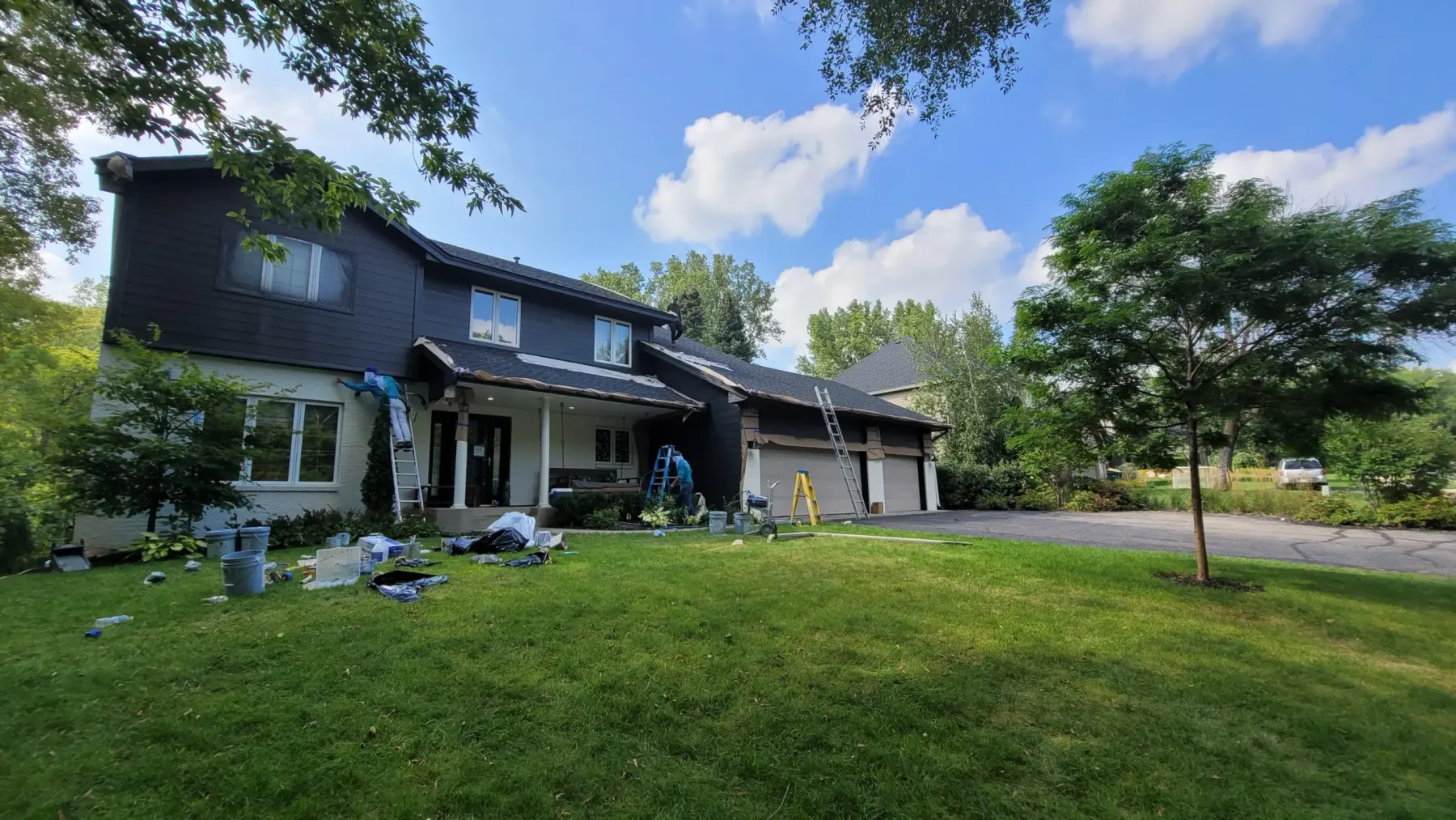 Full exterior repaint in navy by Lakeview Paintworks
