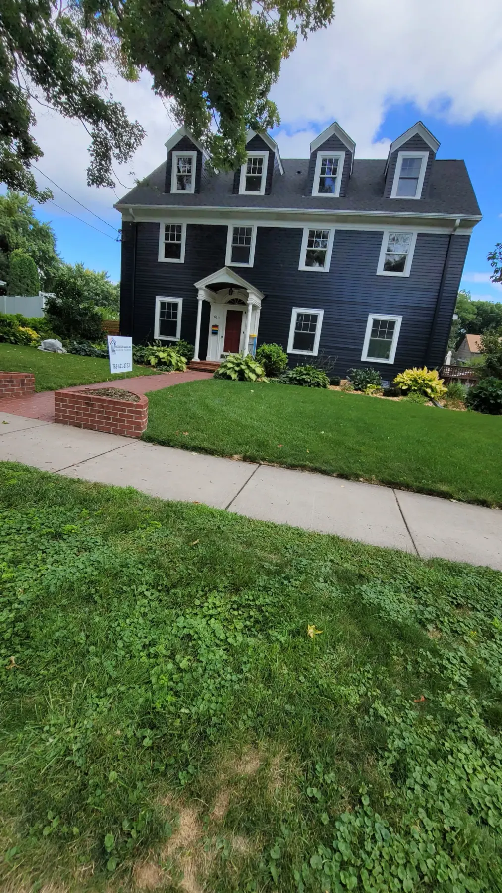 Colonial home exterior painted navy