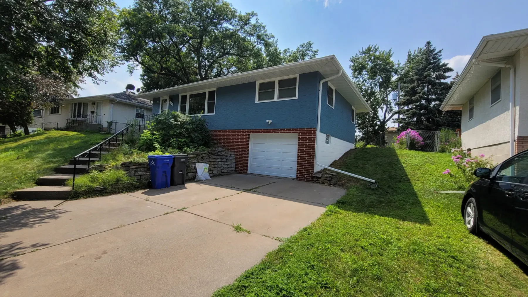 Split-level home exterior by Lakeview Paintworks