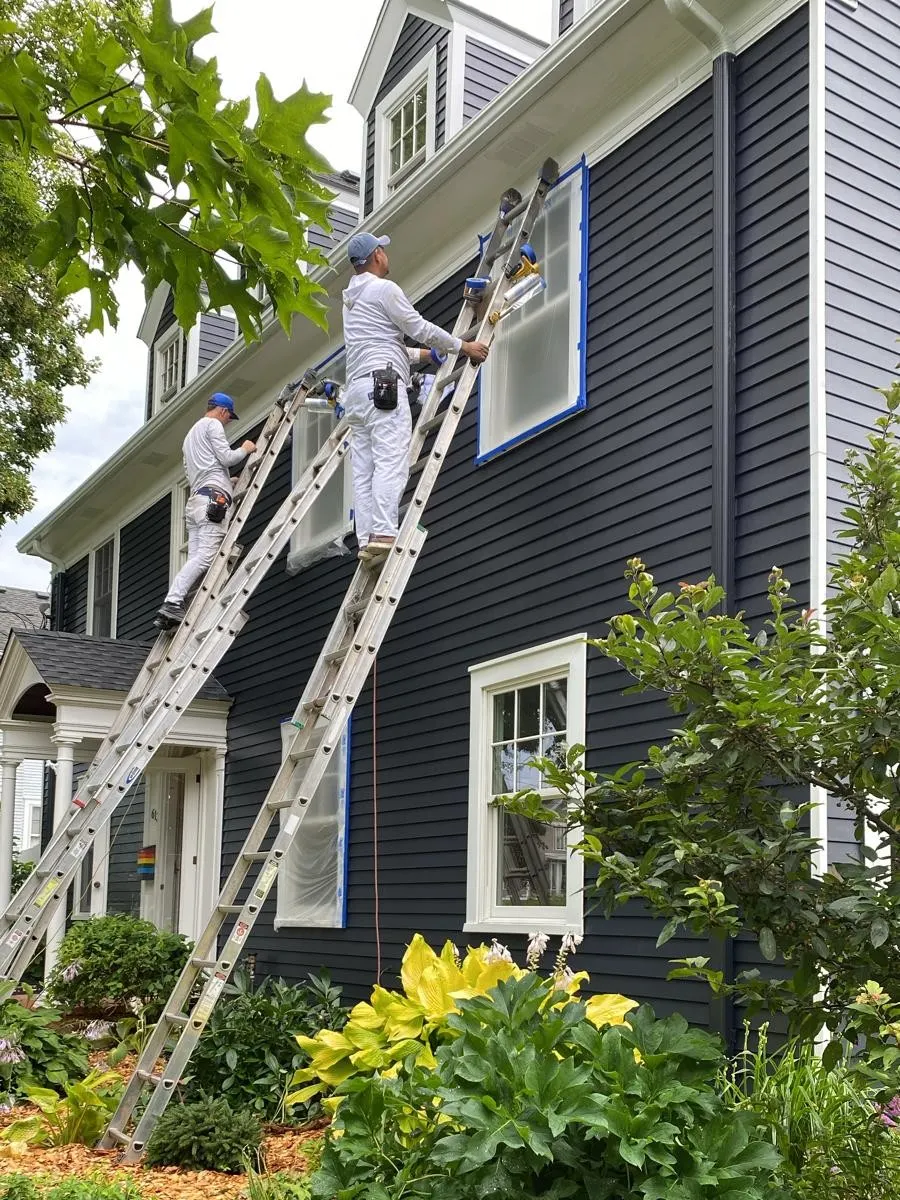 Lakeview Paintworks crew painting a two-story home